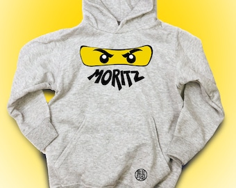 Ninjago Hoodie, Kinder Hoodie, Ninja Augen Masken, Hoodie mit Namen personalisieren, Kinder Geschenktipp Idee für Jungen und Mädchen