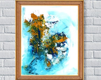 May include: Abstract art print in a gold frame. The artwork features a blend of blue, gold, and green brushstrokes on a white background. The frame is a warm, light brown color, adding a classic touch to the modern art piece.