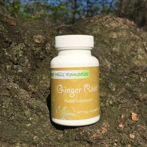 May include: White bottle of West Hills Remedies Ginger Root Herbal Supplement with a yellow label. The bottle contains 60 vegetarian capsules.
