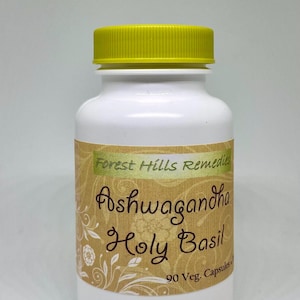 May include: White bottle with a yellow lid labelled "Forest Hills Remedies Ashwagandha Holy Basil 90 Veg. Capsules"