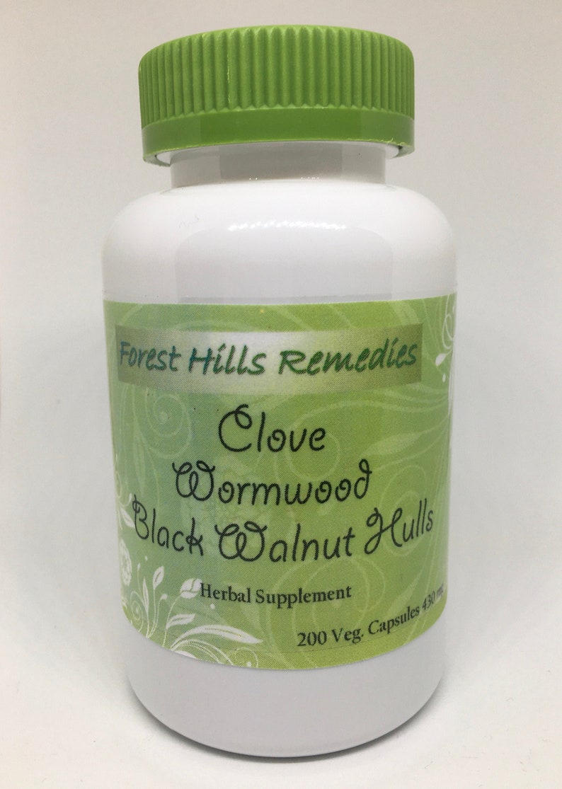 May include: White plastic bottle with a green lid, labeled "Forest Hills Remedies Clove Wormwood Black Walnut Hull's Herbal Supplement 200 Veg. Capsules 430g"