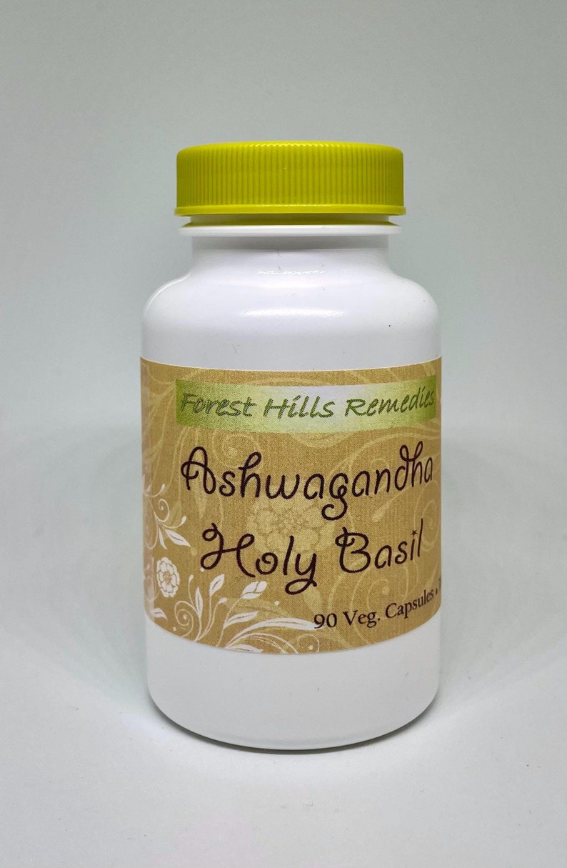 May include: White bottle with a yellow lid labelled "Forest Hills Remedies Ashwagandha Holy Basil 90 Veg. Capsules"