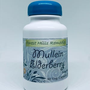 May include: A white bottle with a blue cap, labeled "Forest Hills Remedies." The label features the words "Mullein Elderberry" in elegant script, with floral and botanical illustrations. Contains 90 Veg. Capsules.