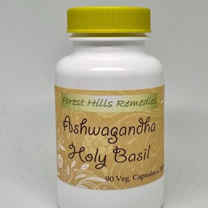 May include: White bottle with a yellow lid labelled "Forest Hills Remedies Ashwagandha Holy Basil 90 Veg. Capsules"