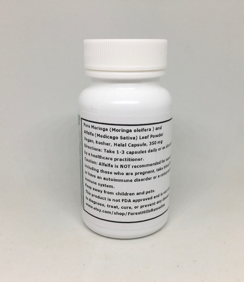 May include: White plastic bottle with a black label. The label reads "Pure Moringa (Moringa oleifera) and Alfalfa (Medicago Sativa) Leaf Powder Vegan, Kosher, Halal Capsule, 350mg Directions: Take 1-3 capsules daily or as directed by a healthcare practitioner. Caution: Alfalfa is NOT recommended for including those who are pregnant, take blood thinners, or have an autoimmune disorder or a compromised immune system. Keep away from children and pets. This product is not FDA approved and is not intended to diagnose, treat, cure, or prevent any disease. www.etsy.com/shop/ForestHillsRemedies"