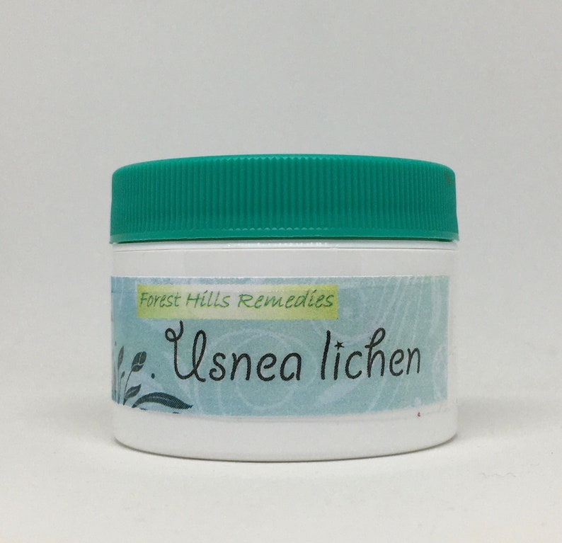 May include: A white jar with a green lid, labelled "Forest Hills Remedies" and "Usnea lichen".