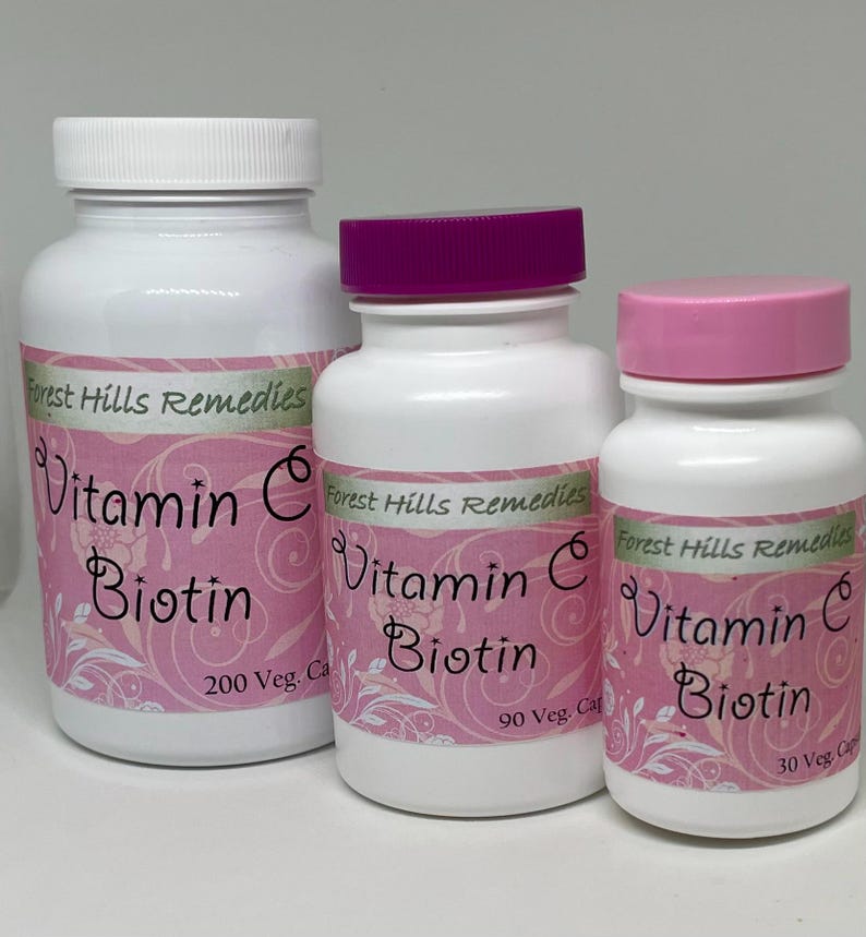 May include: Three white supplement bottles with pink labels and lids. The labels read "Vitamin C Biotin" and "Forest Hills Remedies". The largest bottle has 200 capsules, the middle has 90, and the smallest has 30.