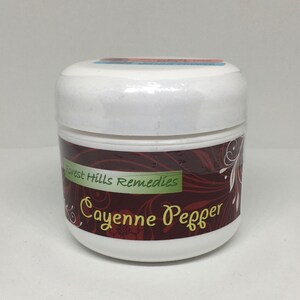 May include: A white jar with a red and brown label that says "Forest Hills Remedies Cayenne Pepper".