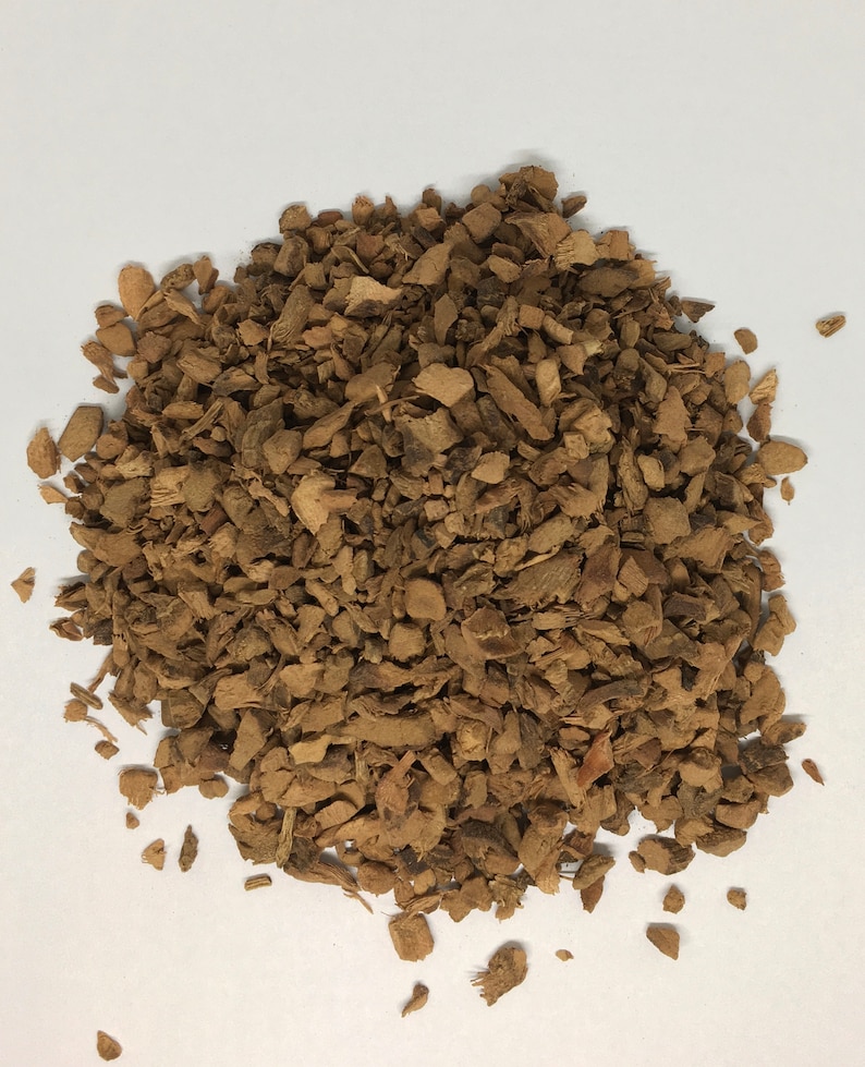 May include: A pile of brown, dried, and chopped root bark.