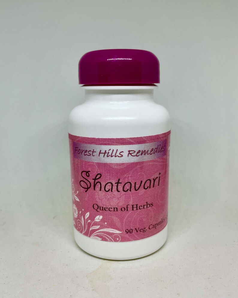 May include: White bottle with a purple lid labelled "Forest Hills Remedies Shatavari Queen of Herbs 90 Veg. Capsules"