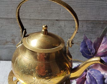 Miniature,  ornamental brass kettle / tea pot and trivet stand