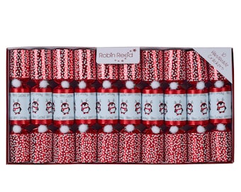 May include: A box of ten handmade Christmas crackers. The crackers are red with white polka dots and stripes. The middle row features crackers with penguin illustrations and the words "Merry Christmas". Each cracker has a white pom-pom.