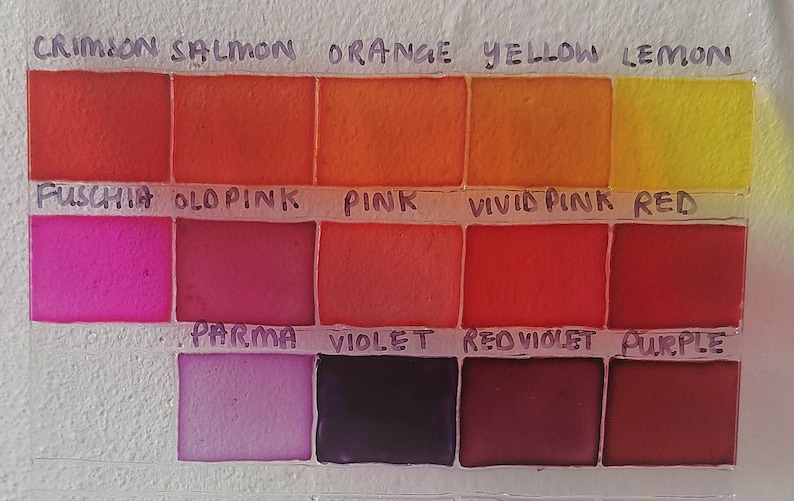 May include: A color chart with 12 paint swatches labeled with the names of the colors: Crimson, Salmon, Orange, Yellow, Lemon, Fuschia, Old Pink, Pink, Vivid Pink, Red, Parma, Violet, Red Violet, and Purple.