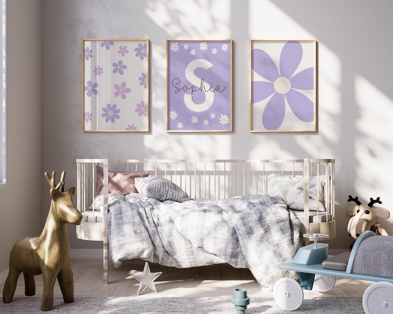 May include: Three framed prints with a purple and white floral design. The center print features the name "Sophia" in white lettering.