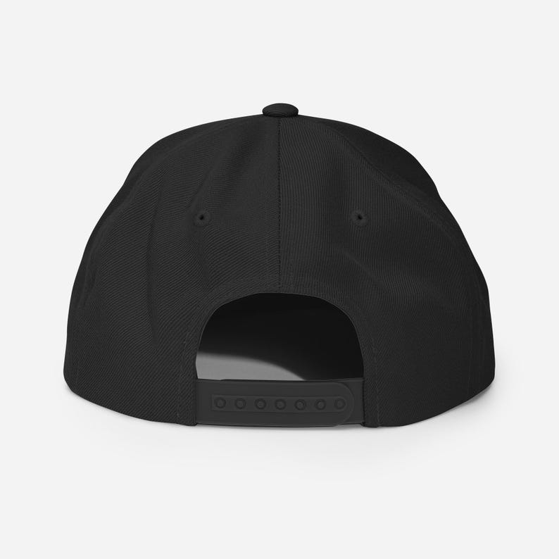 May include: Black baseball cap with a flat brim and a black strap in the back.