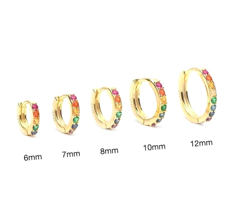 May include: Five gold hoop earrings with a rainbow of colourful gemstones set around the hoop. The hoops are available in sizes 6mm, 7mm, 8mm, 10mm, and 12mm.