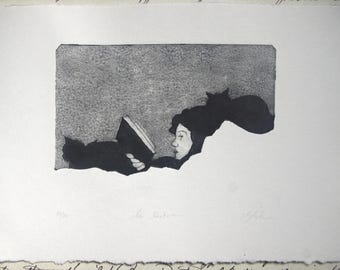 Estampado: Lectura. Grabado en Tetra Pak. Impresión en Tetra Pak. Impresión de gato.