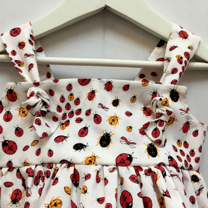 Handmade girls summer dress for ages 2-3 years in ladybird cotton fabric and adjustable straps