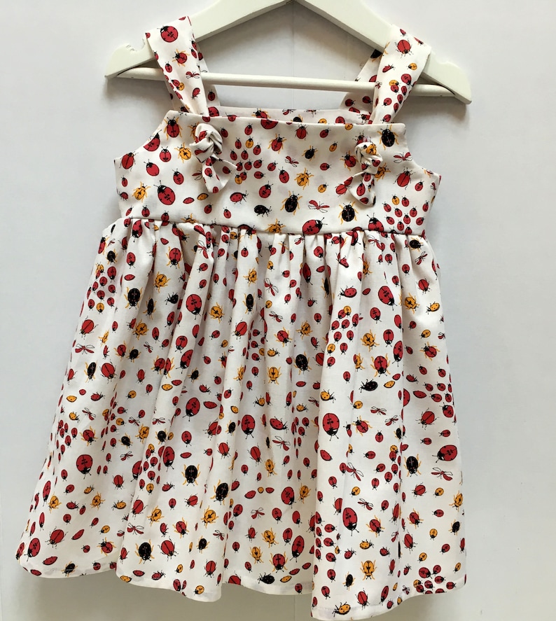 Handmade girls summer dress for ages 2-3 years in ladybird cotton fabric and adjustable straps