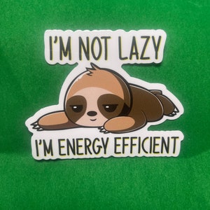 May include: A white sticker with a cartoon sloth and the text "I'm not lazy I'm energy efficient".