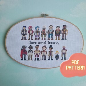 May include: Cross-stitch embroidery featuring pixelated figures, arranged in two rows, with the text "love and legacy." The artwork is set within an oval wooden hoop. A peach-colored speech bubble with "PDF PATTERN" is in the lower right corner.