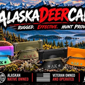 May include: Five deer calls in white, gradient pink and blue, olive green, black, and orange, each featuring a flared base with the text AK and a black cord. The background displays a deer, mountain landscape, and the text ALASKADEERCALLS.COM.