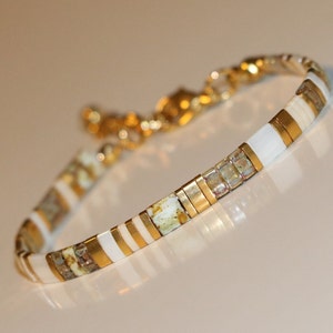 tila bracelet , random pattern of tile beads (square, half and quarter) in white, caramel, picasso yellow, transparant topaz and gold. classy, dainty bohemian style bracelet. Lightweight. stainless steel lobster clasp and extensionchain.