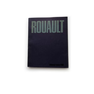 May include: A black booklet with the title "ROUAULT" printed in green on the front cover. The text "Edinburgh Festival 1983" is printed in black at the bottom of the cover.