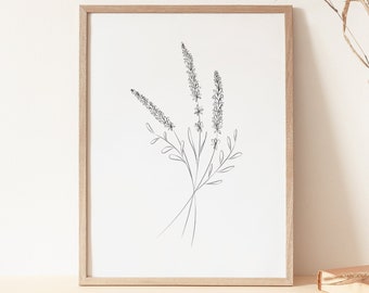 May include: A framed black and white line drawing of a bouquet of flowers, with a wooden frame and a vase with dried flowers on a light brown surface.