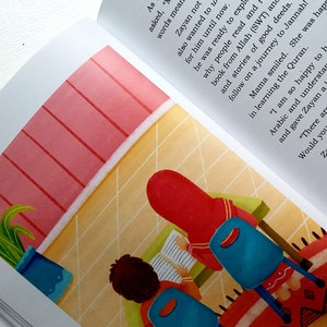 May include: Two children sit at a table reading books. The girl is wearing a red hijab and the boy is wearing a blue shirt. The room has a pink wall and a tiled floor. The text in the image reads: "As asked, "words mean Zayan not also wanted to u for him until now. he was ready to expl why people read and f book from Allah (SWT) and and stories of good deeds. follow on a journey to Jannah! in learning the Quran. Mama smiled. She was happ and gave Zayan a kiss. "I am so happy to hear that you Arabic and understand the Quran bet and gave Zayan a kiss. "There are Arabic classes Would you like to learn Ara Zayan's eyes spark Mama promis Sunday schoo about aski parts of"