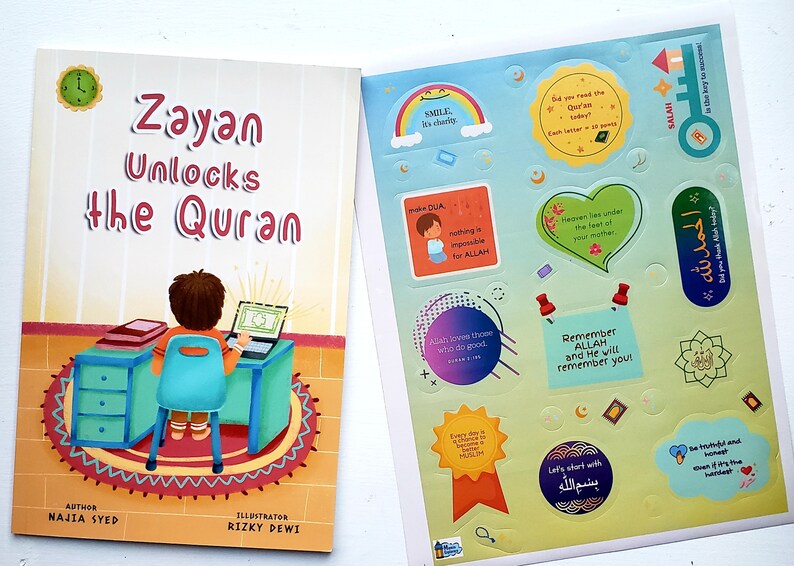 May include: A colorful book titled "Zayan Unlocks the Quran" with an illustration of a young boy sitting at a desk with a laptop. The book comes with a set of stickers featuring Islamic quotes and illustrations.