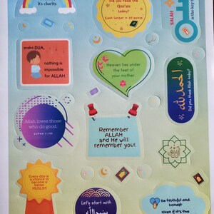 May include: Colorful stickers with Islamic quotes and illustrations. The stickers feature a rainbow, a key, a heart, a star, a crescent moon, a mosque, and a prayer rug. The text on the stickers includes "Smile, it's charity", "Make Dua", "Allah loves those who do good", "Remember Allah and He will remember you", "Every day is a chance to become a better Muslim", "Let's start with Bismillah", "Be truthful and honest even if it's the hardest", "Did you read the Quran today?", "Heaven lies under the feet of your mother", "Did you thank Allah today?", and "Salah is the key to success!"