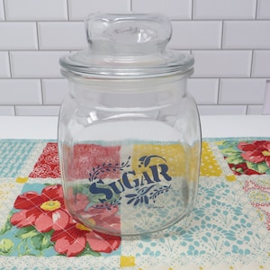 Anchor Hocking Glass Kitchen Canister Vintage 1990 Sugar approximately 7&quot; including the lid, blue lettering
