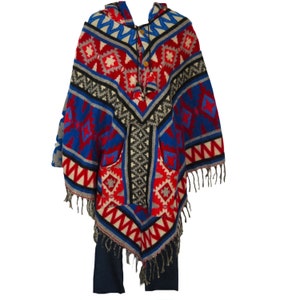 May include: A blue, red, and white patterned poncho with a hood and fringe. The poncho has a pocket on the front.