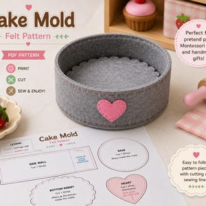 May include: A gray felt cake mold with a pink heart applique on the side. The item is accompanied by a printed PDF pattern sheet labeled Cake Mold, featuring diagrams for the side wall, base, bottom insert, and heart shape for sewing projects.