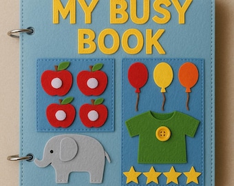 Puede incluir: Un libro de fieltro azul claro con las palabras "MY BUSY BOOK" en amarillo. El libro presenta aplicaciones de fieltro de manzanas rojas, globos, una camisa verde, un elefante y estrellas amarillas. El libro está encuadernado con anillas metálicas.