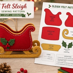 May include: A DIY felt sleigh sewing pattern featuring a red and gold felt sleigh ornament with holly embellishments. The pattern sheet includes labelled cutouts for sleigh sides, bottom, runners, and holly pieces with clear sewing instructions.