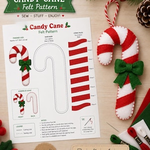 May include: A Candy Cane Felt Pattern instruction sheet with diagrams, cutting lines, and sewing guides. Next to it is a finished felt candy cane ornament with red and white stripes, a green felt bow, and a red and white striped hanging loop.