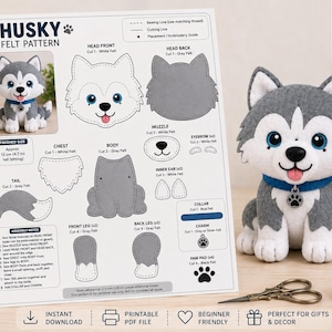 Pode incluir: Uma folha de molde de feltro de Husky com instruções de montagem, formas recortadas para a cabeça, corpo e membros, e um peluche de Husky cinzento e branco acabado com uma coleira azul e um pendente de pata, com 12 cm de altura.