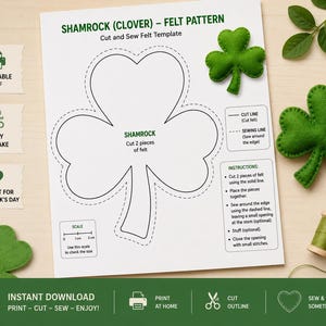 May include: A white paper template for a shamrock felt craft featuring a large clover outline, a 2 cm scale, and instructions. The sheet includes text: SHAMROCK (CLOVER) - FELT PATTERN, Cut and Sew Felt Template, and instructions for sewing.