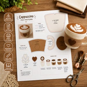 Puede incluir: Una hoja de patrón de fieltro Cappuccino con una plantilla impresa para una taza de café con diseño de corazón, que incluye instrucciones de montaje, una taza de fieltro terminada, hilo de bordar y tijeras sobre una superficie de madera.