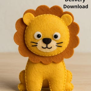 May include: A handmade felt lion toy in a sitting position. The lion is primarily yellow with a brown mane and accents. It has black whiskers and a black nose. The text "Delivery Download" and "PDF Pattern + tutorial" are visible.