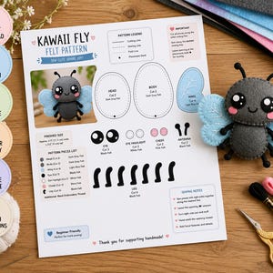 May include: A Kawaii Fly felt pattern document featuring instructions, a list of pattern pieces, and a visual guide for creating a gray and light blue felt fly. The document includes a finished felt fly toy, embroidery thread, and scissors.