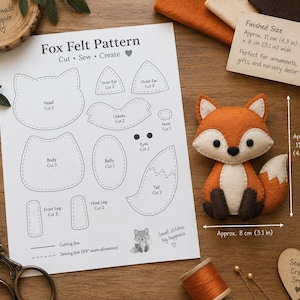 May include: A Fox Felt Pattern instruction sheet with cut-out shapes for a head, ears, cheeks, nose, body, belly, eyes, legs, and tail. Next to it is a finished felt fox plush measuring approximately 11 cm by 8 cm, or 4.3 inches by 3.1 inches.