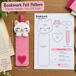 Puede incluir: Un marcapáginas de fieltro con forma de gato y cinta rosa, que mide 15 cm por 4 cm, junto a una hoja de patrón impresa titulada Bookmark Felt Pattern. La hoja incluye plantillas para la cabeza, orejas, patas, corazón y cuerpo, además de una guía.
