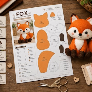 Puede incluir: Un patrón de costura de fieltro para un zorro, que incluye una hoja de instrucciones impresa con diagramas, un peluche de zorro terminado en fieltro naranja y blanco, unas tijeras doradas y una tarjeta de hilo de bordar en naranja, blanco y negro.
