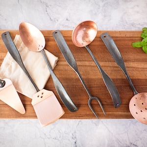 Hand forged black stainless steel and copper six-piece master set   * spatula * ladle * pie server * cast iron skillet