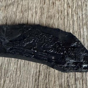 Handcrafted from Coal Raised Relief Crawling Miner on a Coal Base