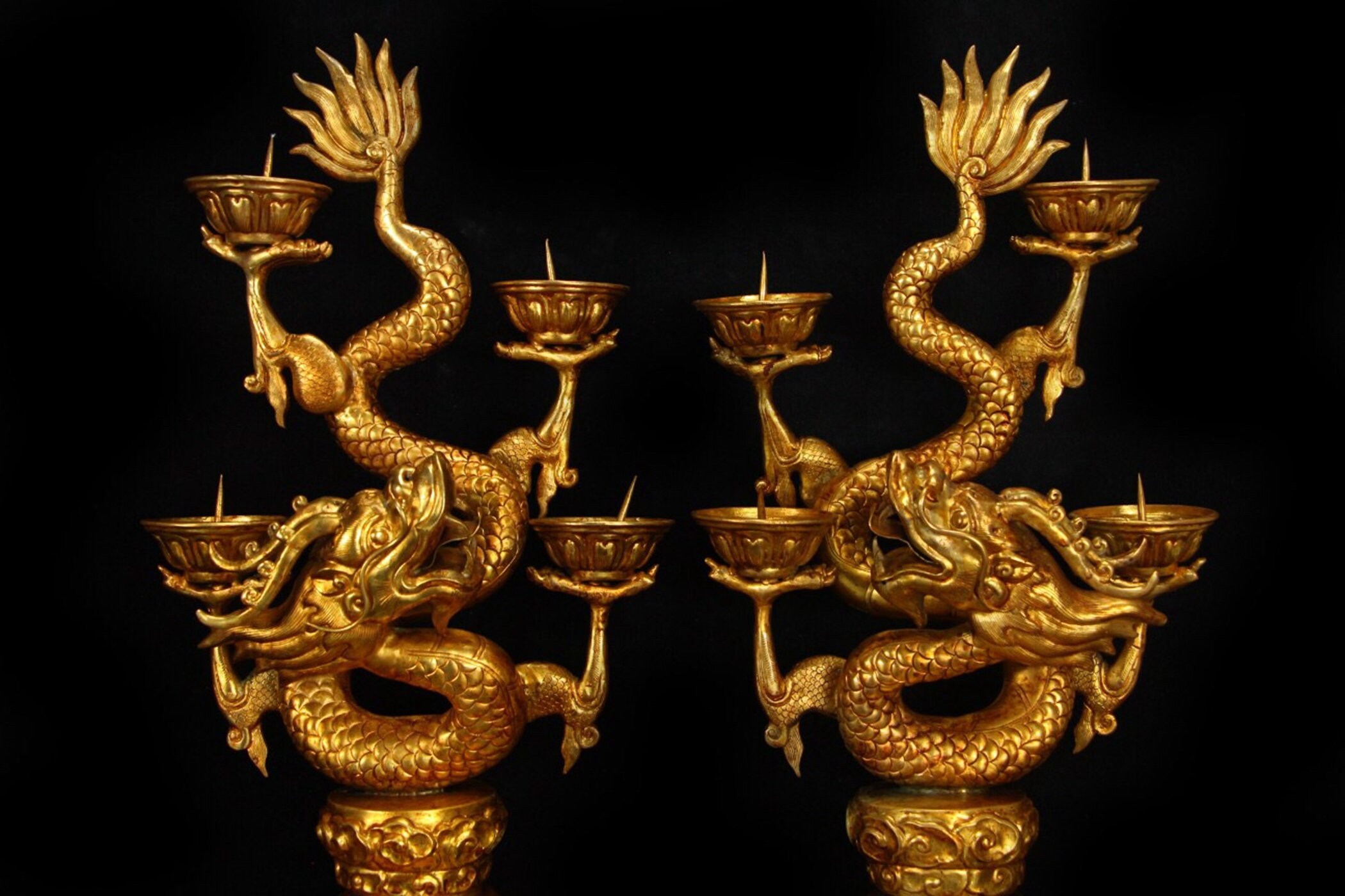 A gilt dragon candlestick from the Qing Dynasty from the Etsy