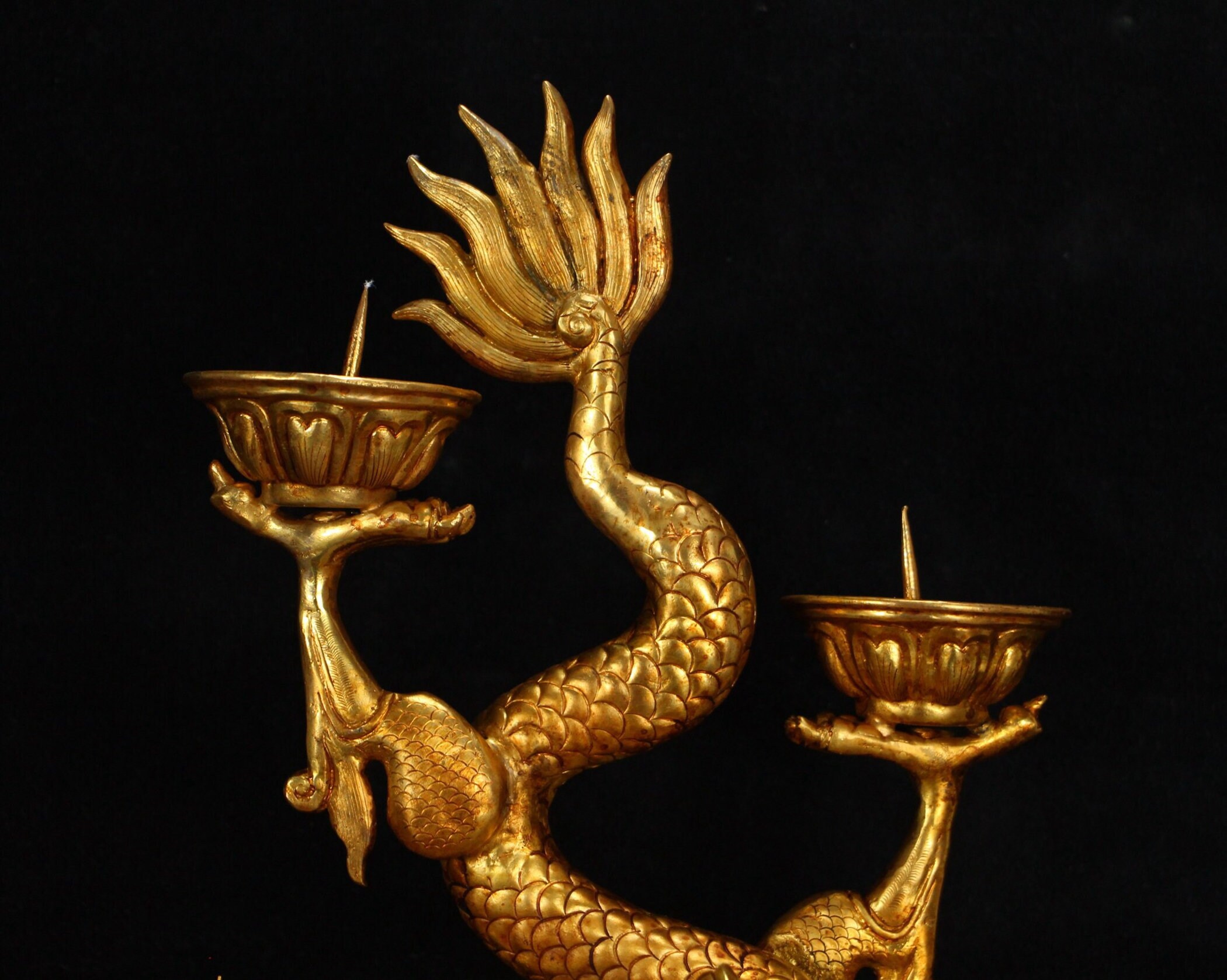 A gilt dragon candlestick from the Qing Dynasty from the Etsy